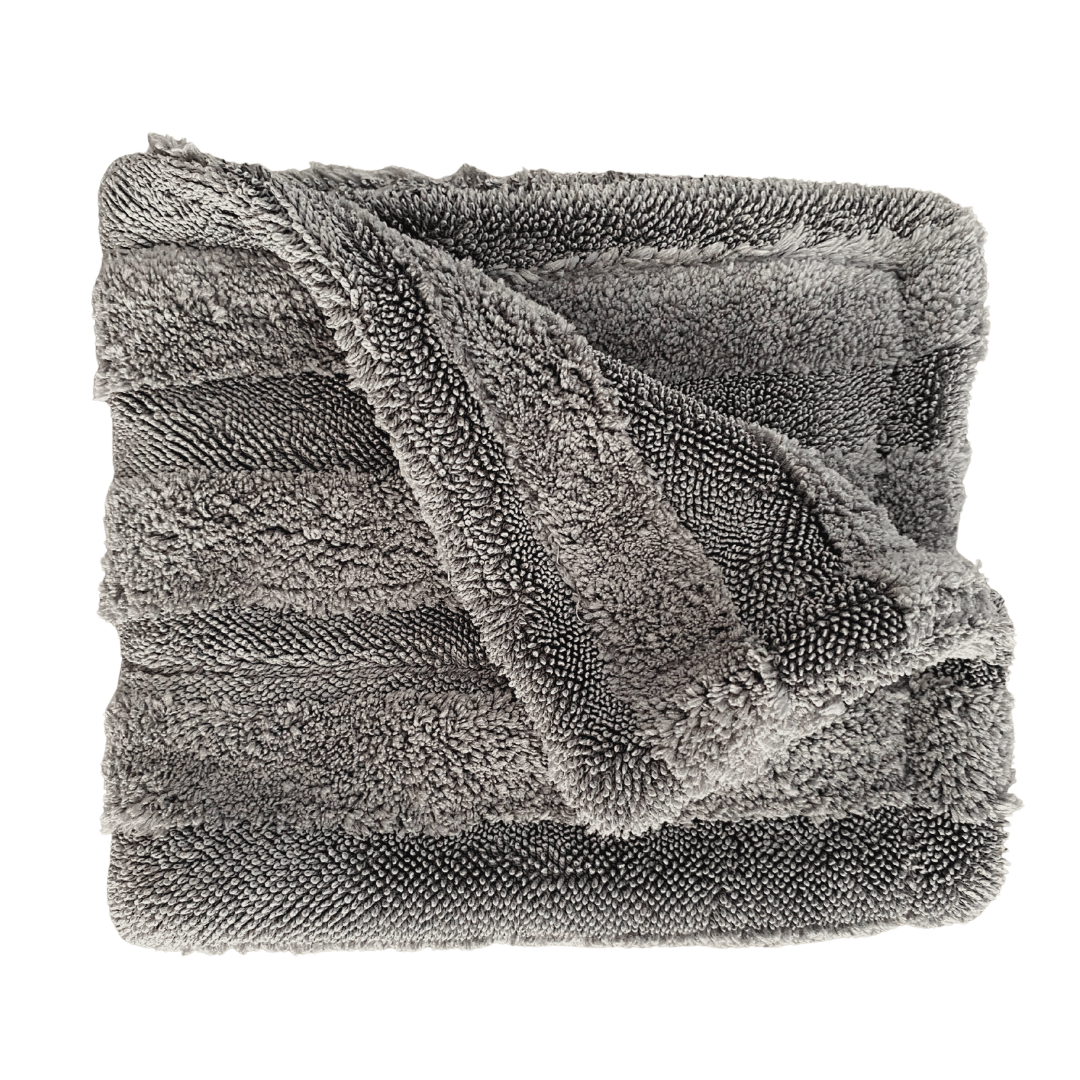 Folded gray textured car drying towels on a white background