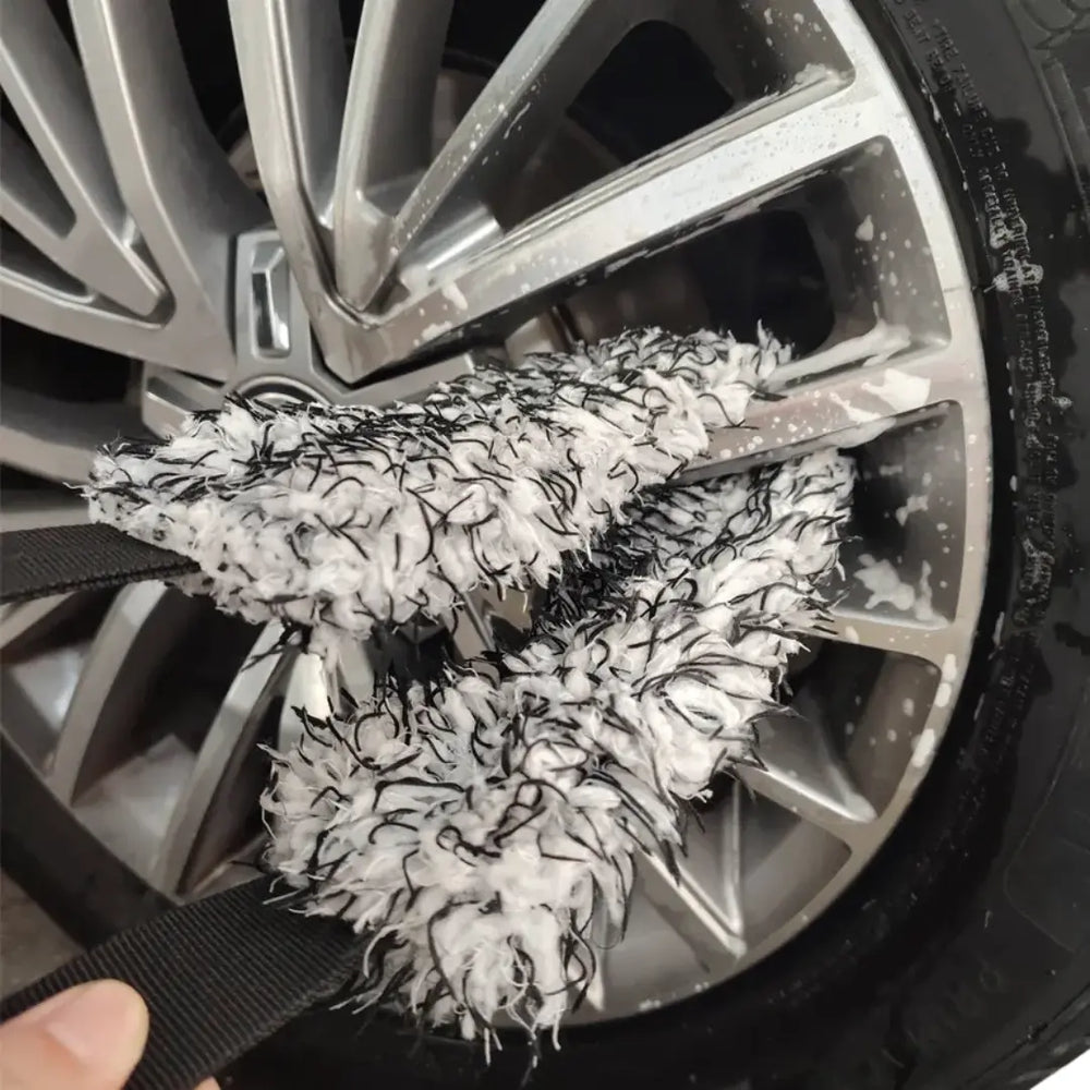 The Fox Tail Wheel Detailing Mitt cleaning between spokes