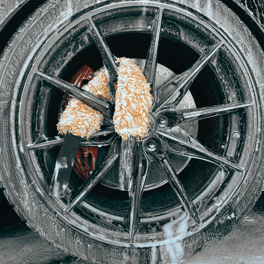 The Fox Tail Wheel Cleaner - front view of a wheel being detailed with a fox tail, the best wheel cleaning tool