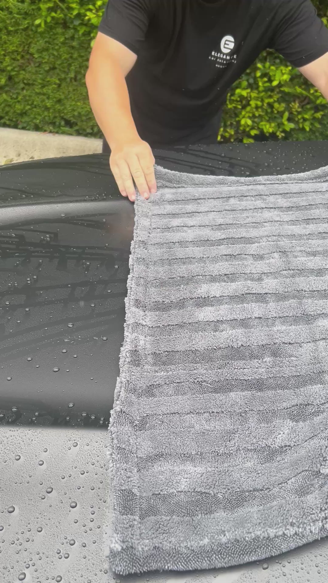 video of premium quality car detailing drying towel showcased to dry a black car hood - by the Fox Tail